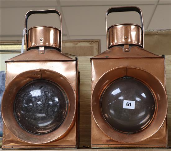 A pair of early 20th century copper railway lamps H.46cm